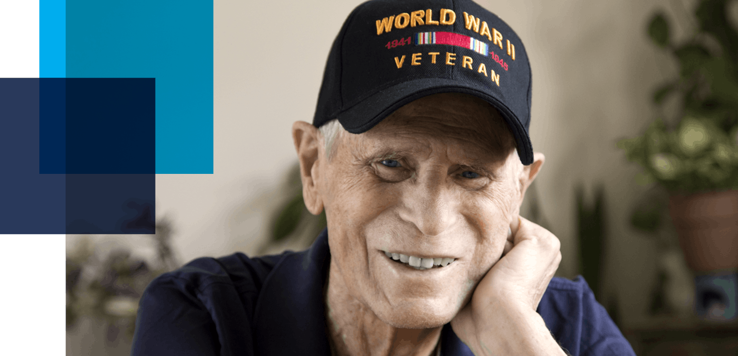 Image shows an older man wearing a World War II veteran hat. Case study image for Cyber VBA service related to: veteran benefit account, digitizing records, accelerating process through automation, veteran services, digital veteran records, digital veteran resources.