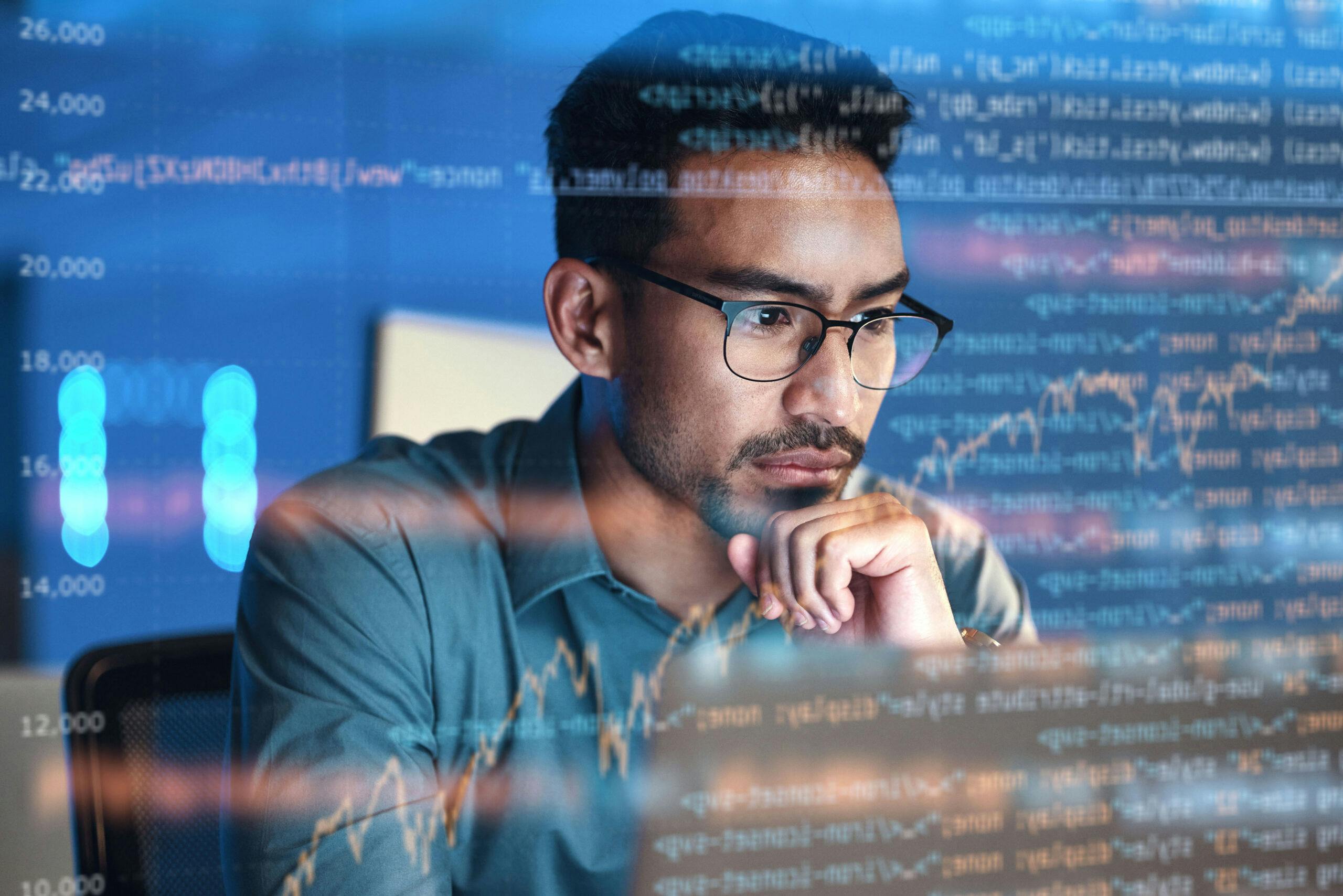 Man looking at computer data