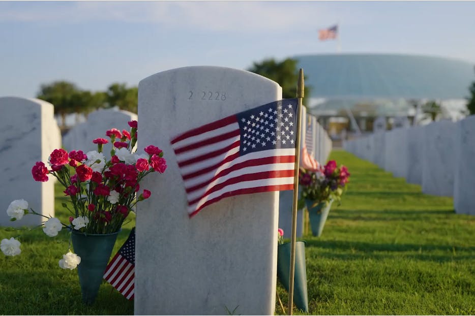 Flag waving in veteran's graveyard