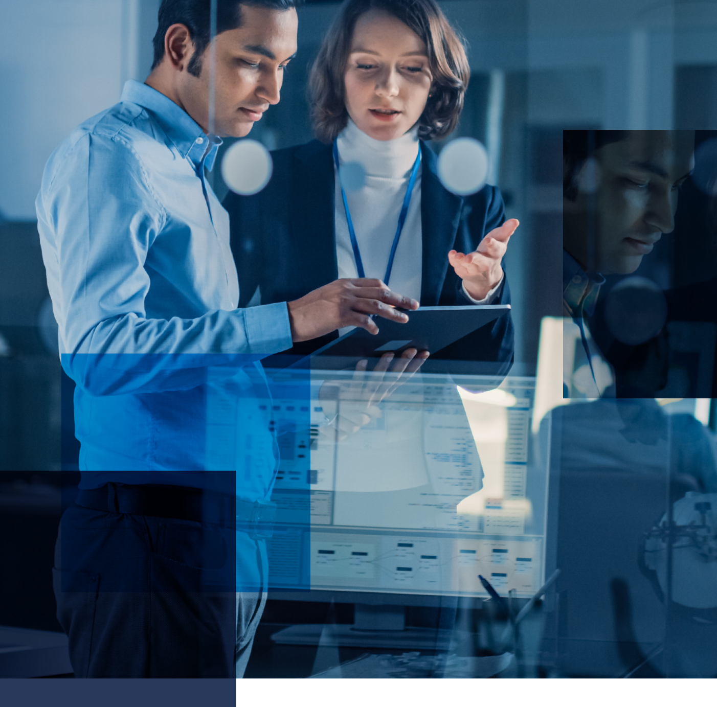 Image for case study of comprehensive cybersecurity program for DHS. Image features a man and woman conferring over a tablet.