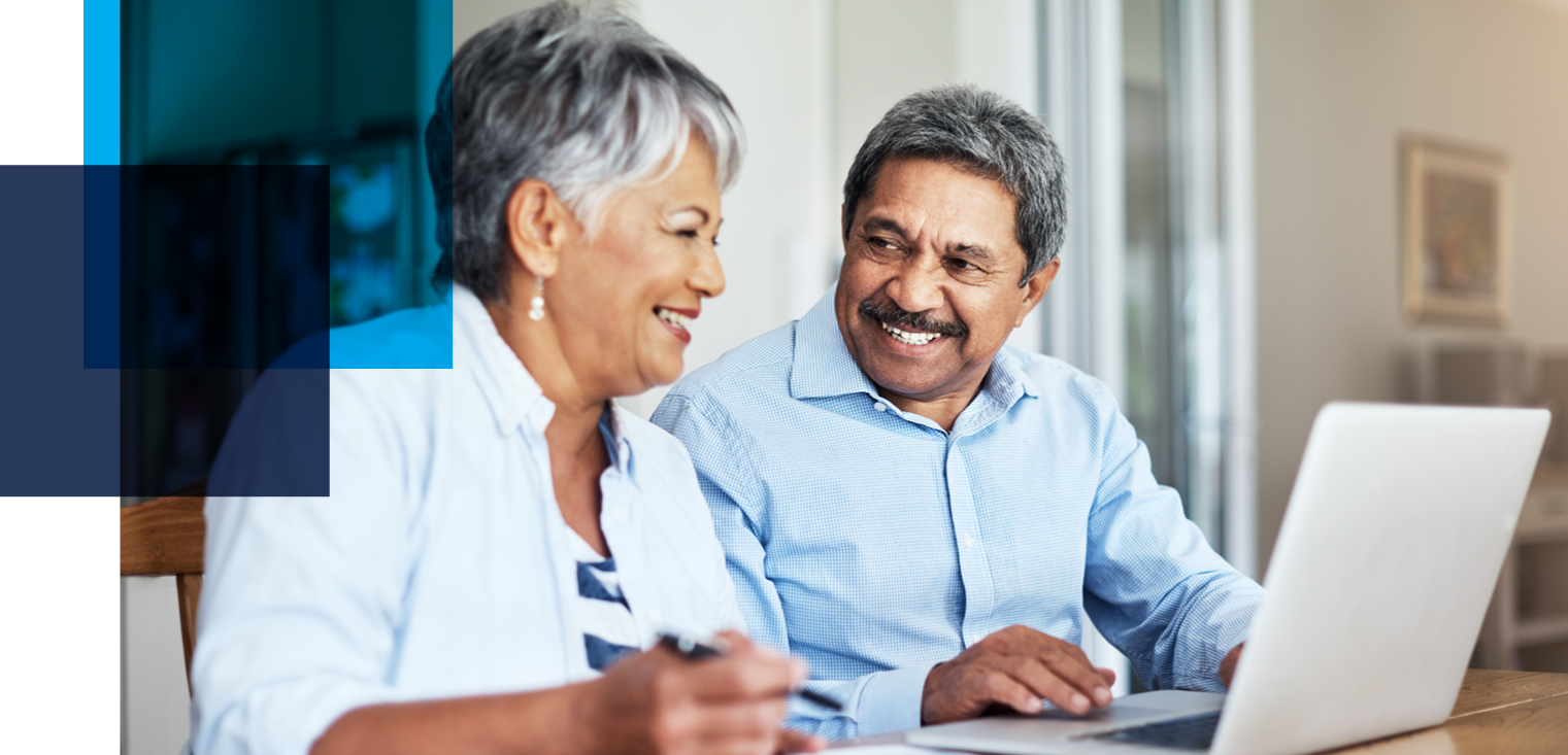 Image shows an older couple smiling at each other in front of an open laptop. Related to: Pension Benefit Guaranty Corporation, modernize actuarial product, scalable technology, efficient business operations, PBGC, and product line maintenance.