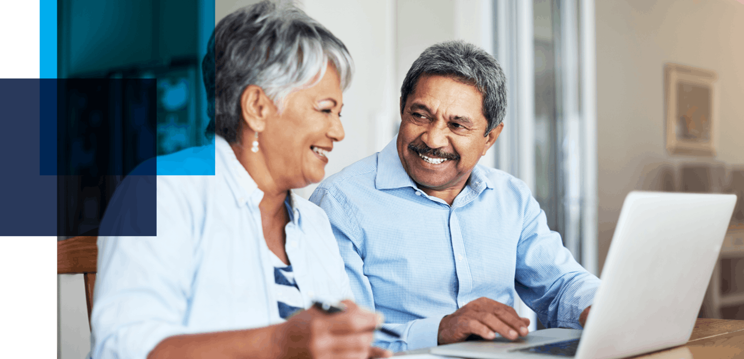 Image shows an older couple smiling at each other in front of an open laptop. Related to: Pension Benefit Guaranty Corporation, modernize actuarial product, scalable technology, efficient business operations, PBGC, and product line maintenance.