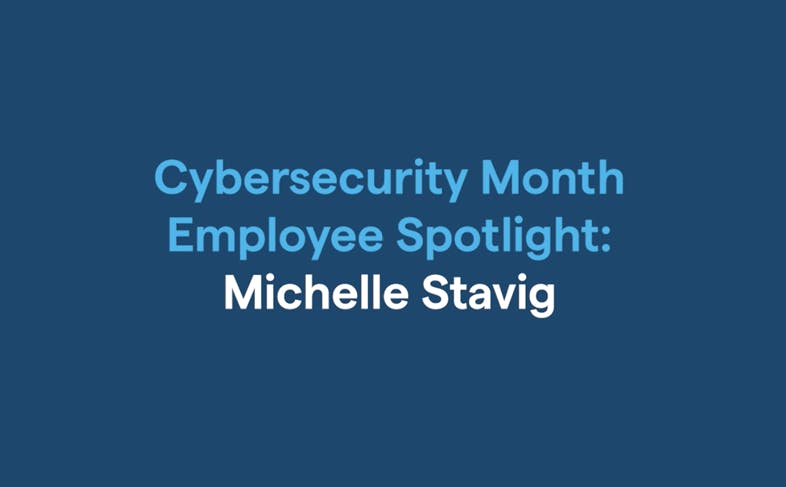 Block of blue with text in lighter blue and white that reads: Cybersecurity Month Smployee Spotlight: Michelle Stavig