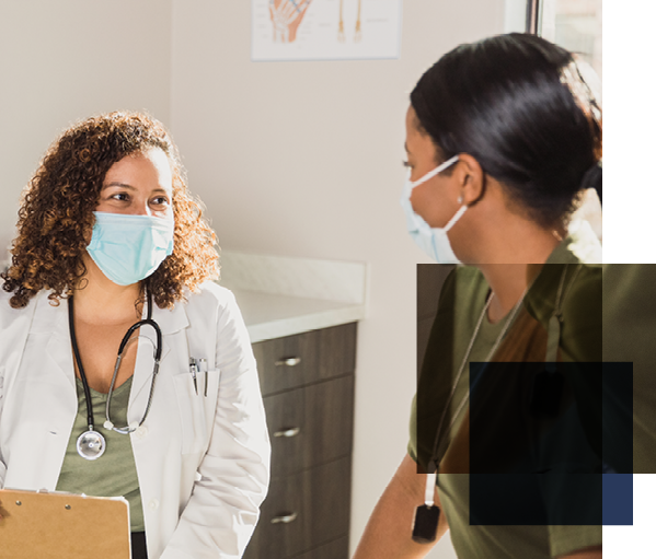 Image shows two women in surgical masks facing each other, one wearing a doctor's coat and stethoscope.