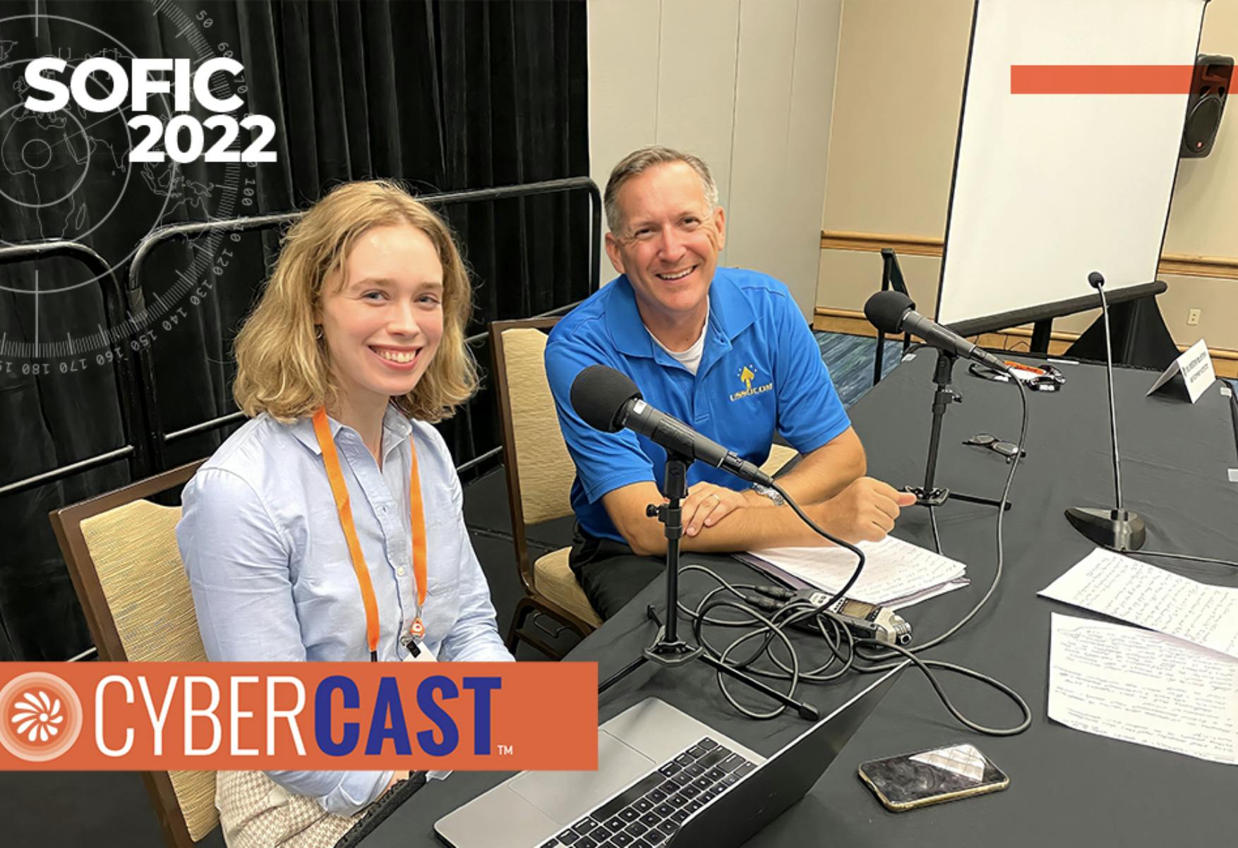 Image of Cybercast host Kate Macri and Col. Joe Pishock, COO, Networks and Services, USSOCOM at recording booth during SOFIC.