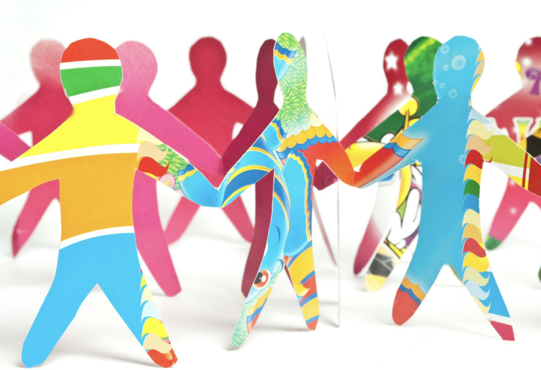 Image of people shapes cut out of colored paper holding hands. Related to: mitigating discrimination, equity, AI bias, algorithm bias, hiring process, AI in resume review, ai bias recruiting, ai bias examples, ai bias in recruiting, ai recruiting tool bias.