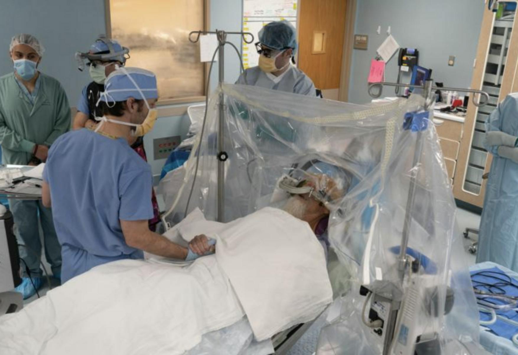 Image of surgeons prepping a patient on a gurney for surgery. Related to 3D printing and healthcare, veterans benefits, veteran care, 3D printing prosthetics.