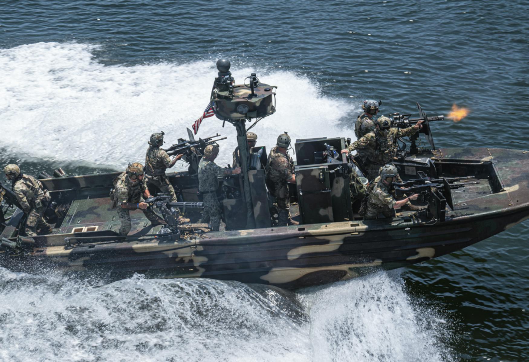 Image of army flat boat with soldiers aboard. Related to: SOCOM, eliminating technical debt, future cloud security, cloud security.
