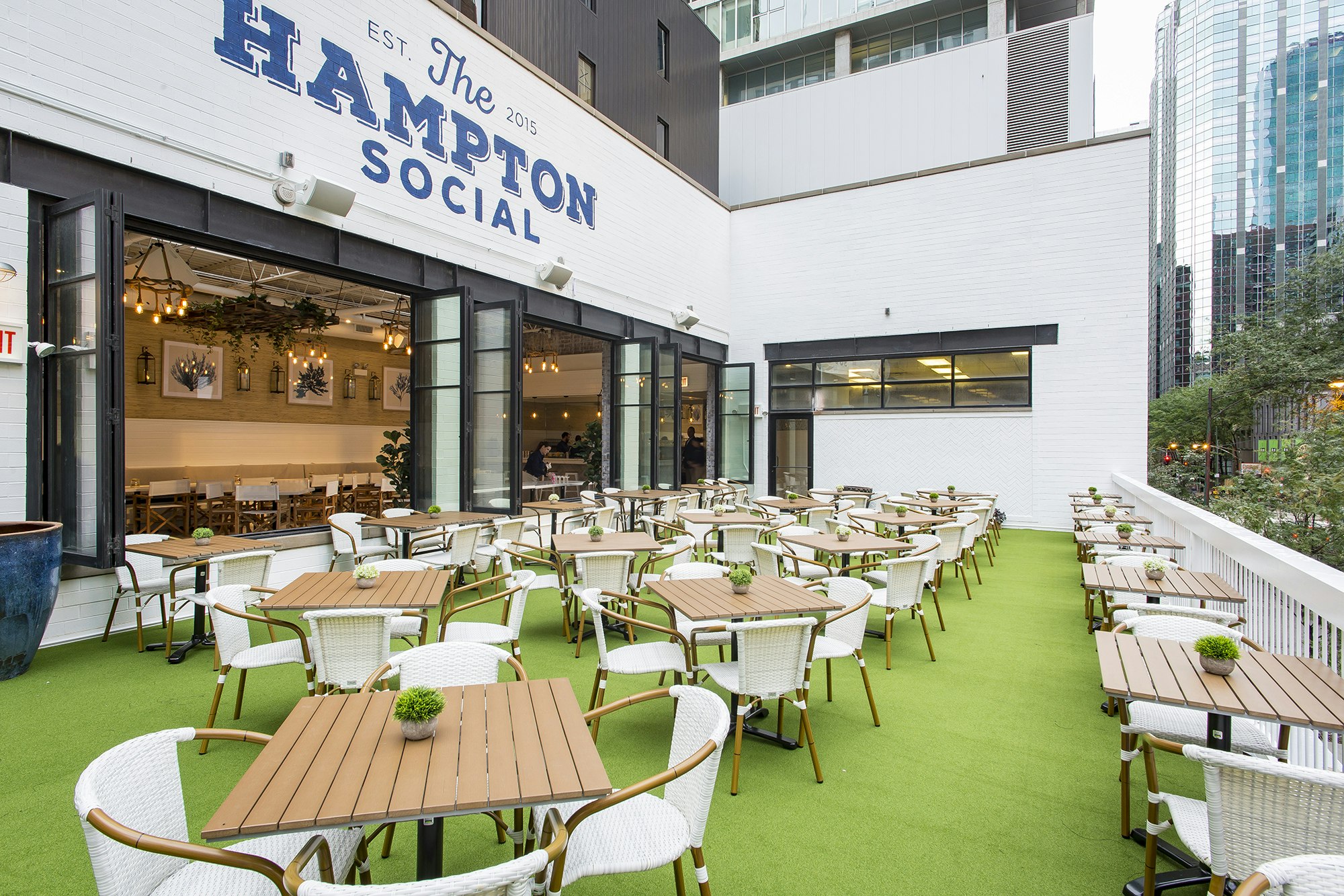 Image of the outside terrace of the Hampton Social club. Related to: HIMSS happy hour, hiring event, hiring event Chicago, health it, health it jobs