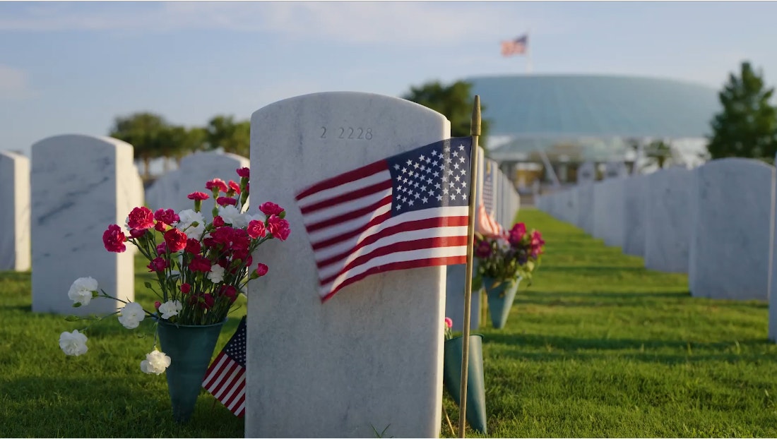 Flag waving in veteran's graveyard