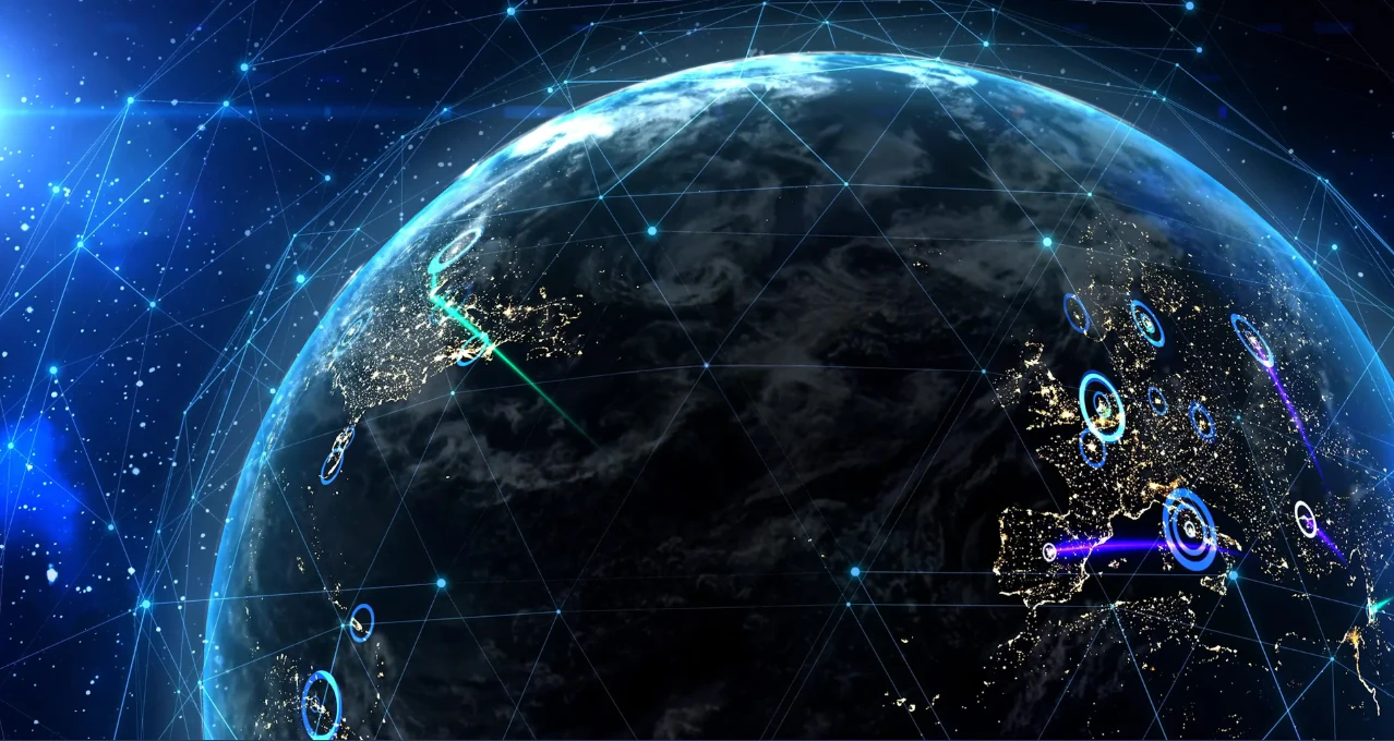 A high‑resolution digital visualization of Earth from space showcasing global connectivity networks. Glowing data points, illuminated city lights, and interconnected lines highlight international communication, cybersecurity activity, and real‑time digital infrastructure across continents.